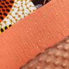 couverture plaid bébé patchwork wax cercles et fleurs jaune orangé et double gaze couleur papaye à pois doré. Doublure en minky à pois